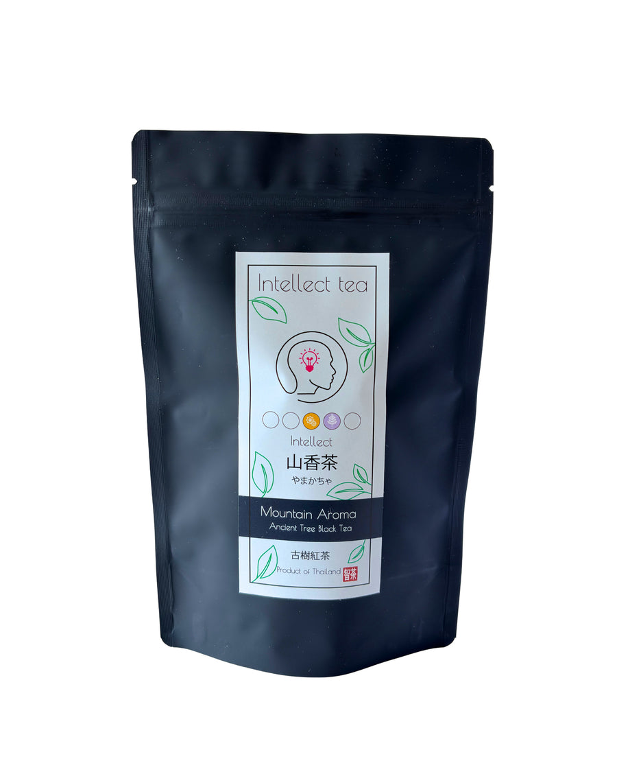 Mountain Aroma tea in a black Intellect Tea pouch, front label visible.